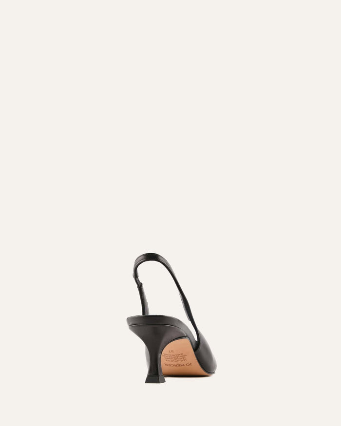 Black and brown shoe with a strap on a white background