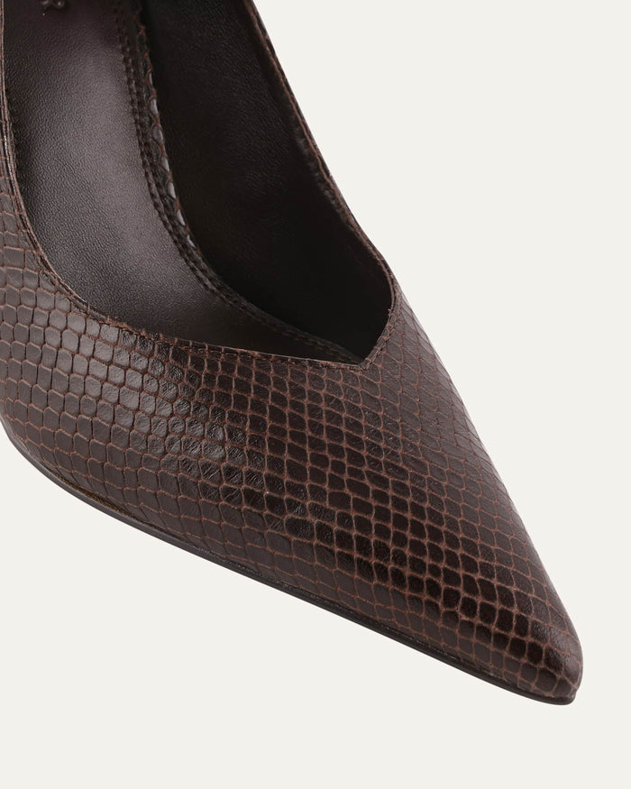 Brown pointed-toe shoe on a light gray background