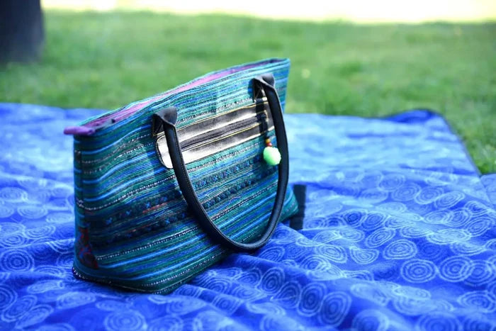 Vindigo tribal hemp tote bag placed on blue outdoor mat