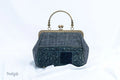 Vindigo black hemp handbag with vintage embroidery and copper frame front view