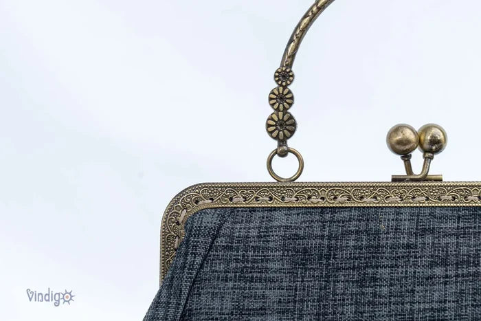 Vindigo handmade black handbag close-up of copper clasp and handle