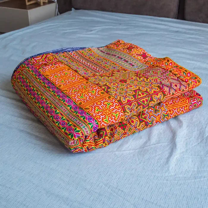 Vindigo handmade orange striped tribal fabric folded for display