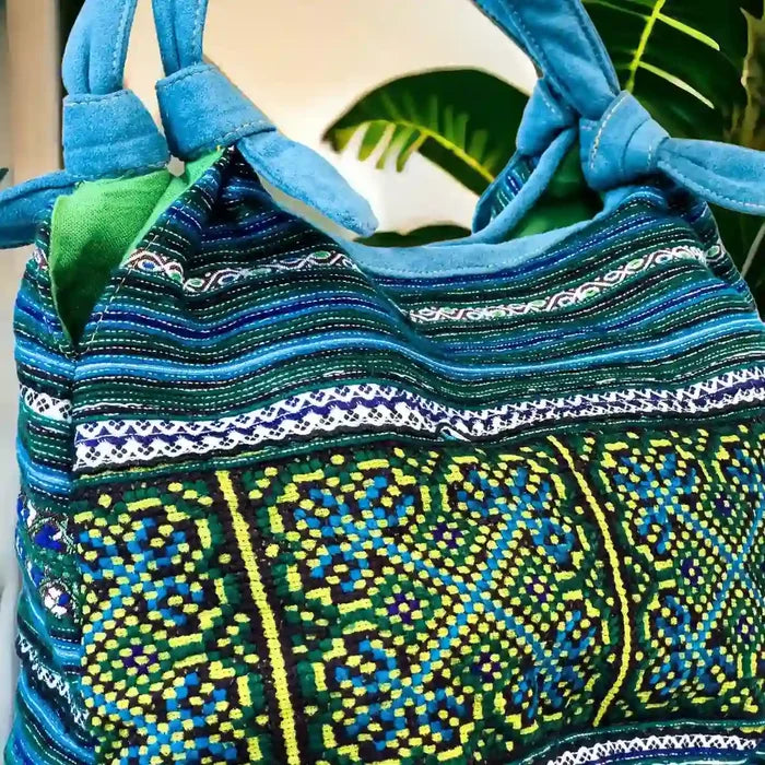 Vindigo handbag blue embroidered side detail view