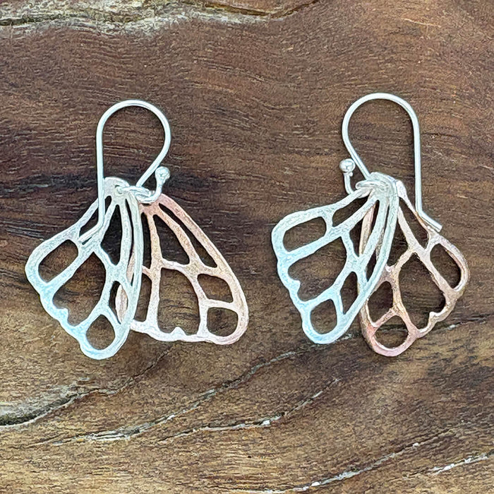 Handmade sterling silver and rose gold butterfly wing earrings with delicate mixed metal artisan design – nature inspired jewelry gift for women