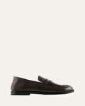 Beige loafer with a buckle on a white background