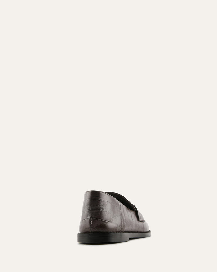 Brown leather shoe on a white background
