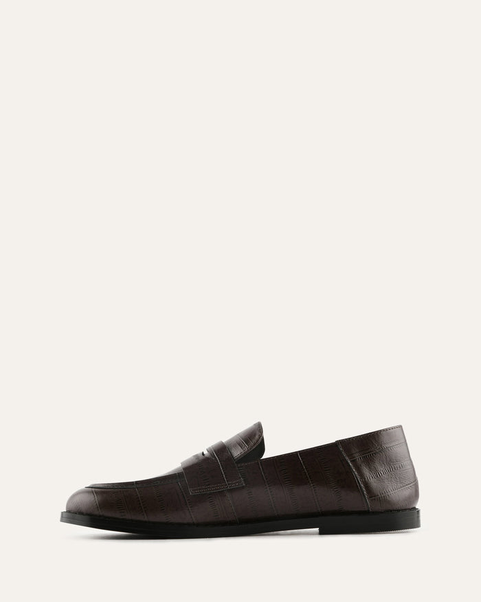 Brown leather loafer on a white background