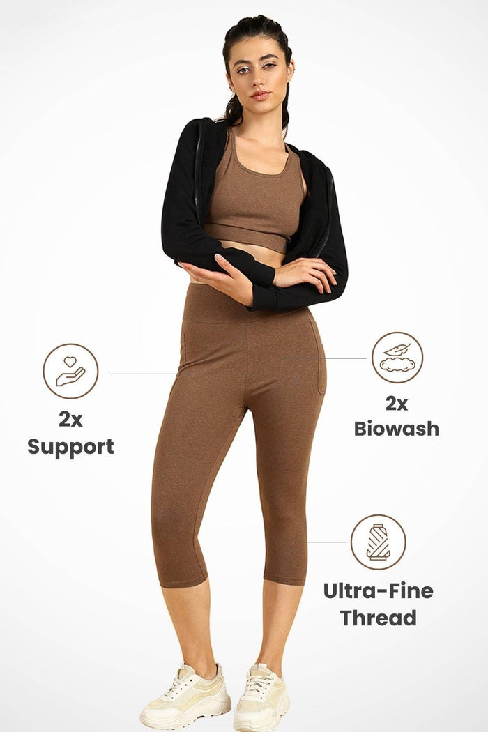 Model wearing Melange Brown Capri; high waist design provides support for the belly.