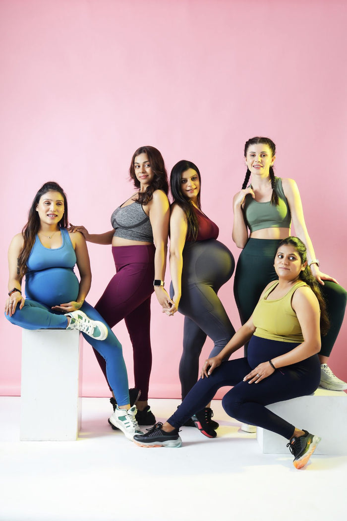 Black Leggings fit; gentle compression aids in postpartum core recovery.