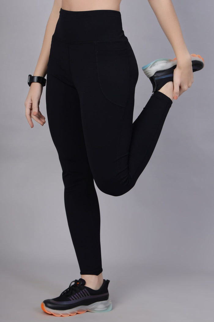 Model wearing Black Leggings; smooth fit ensures comfortable wear under clothing.