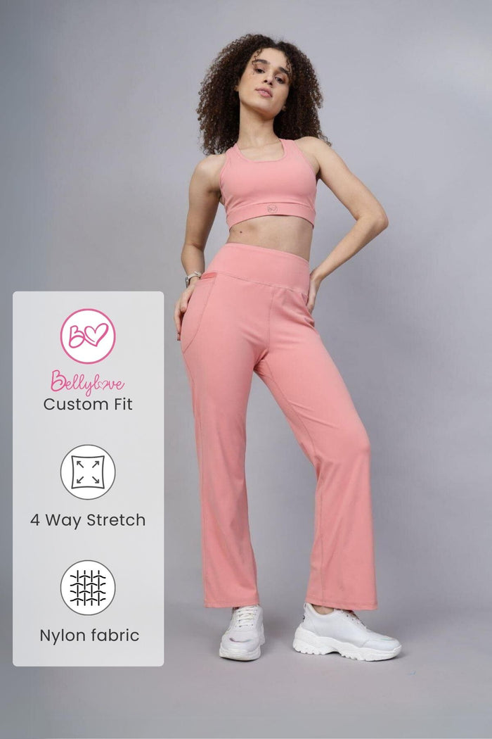 Model wearing Carrot Pants; high waistband provides gentle compression support.