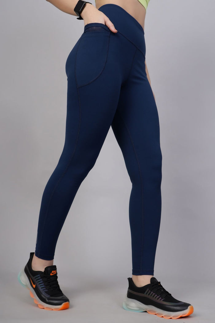 Model wearing Navy Blue Leggings; smooth fit ensures comfortable wear under clothing.