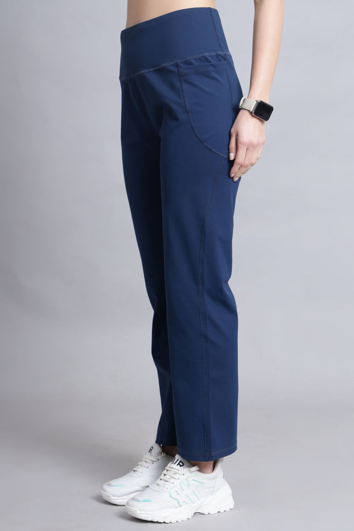Model wearing Navy Blue Pants; smooth fit ensures comfortable wear under tops.