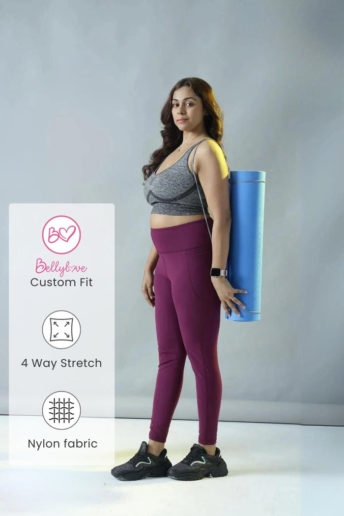 Model wearing Wine Leggings; high waist provides gentle compression support.