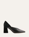 Black high-heeled shoes on a light gray background