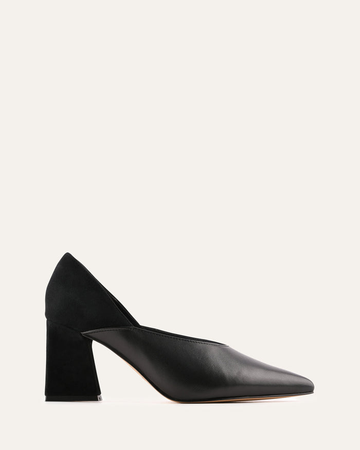 Black high-heeled shoes on a light gray background
