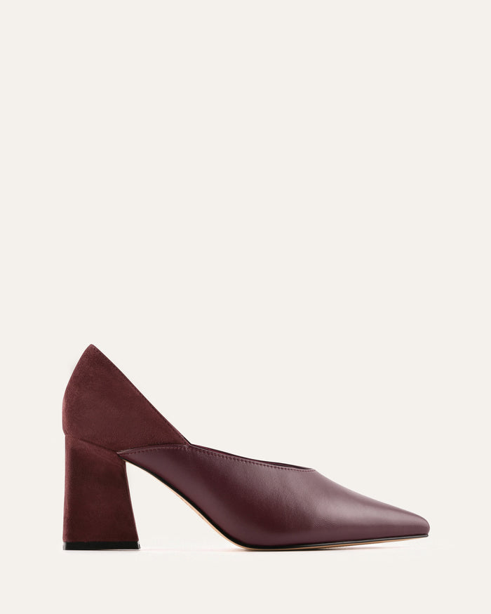 Black high-heeled shoes on a light gray background