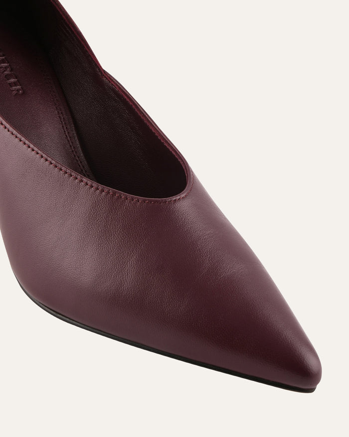Maroon pointed-toe shoe on a light gray background