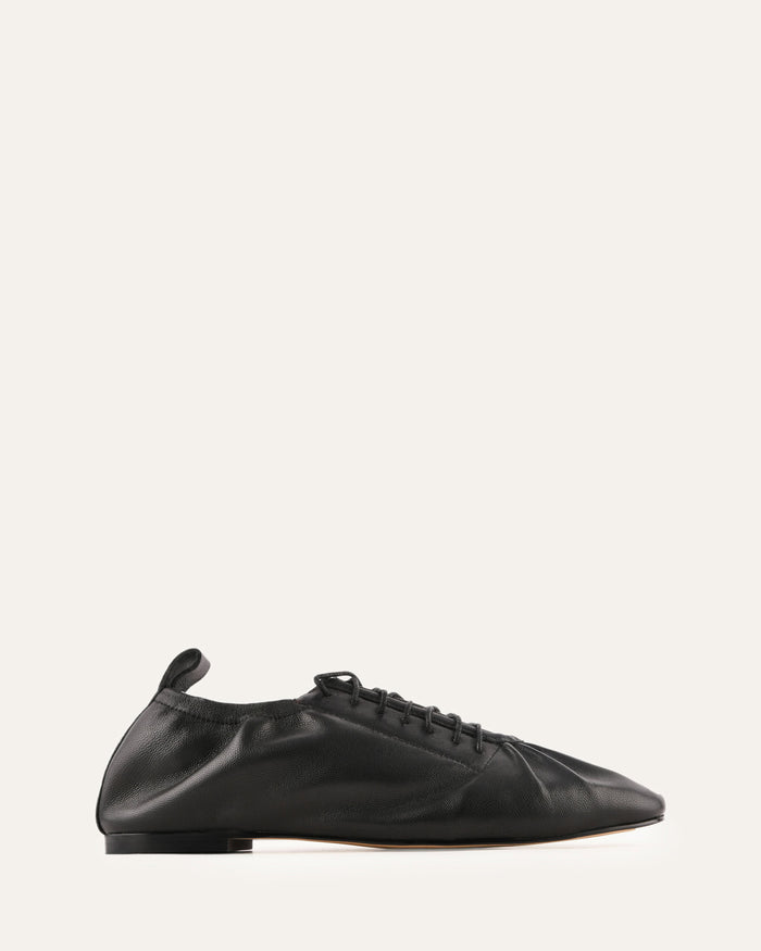 Black leather shoe on a white background