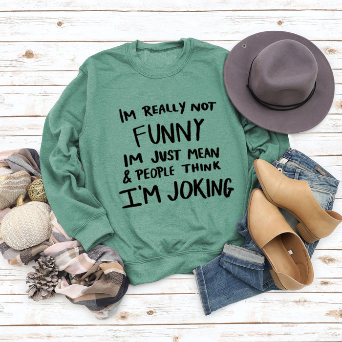Light green sweater (black font) / S