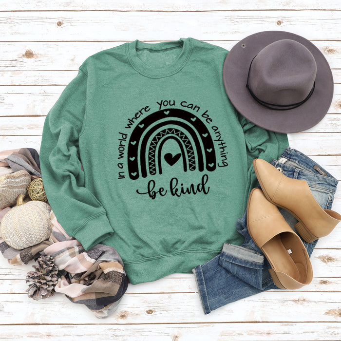 Light green sweater (black font) / S