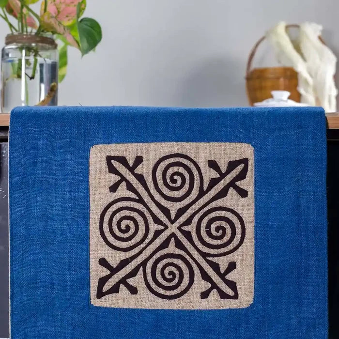 Vindigo blue hemp table runner close-up showing central white cotton embroidery