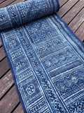 Intricate labyrinth pattern in handwoven hemp, indigo batik