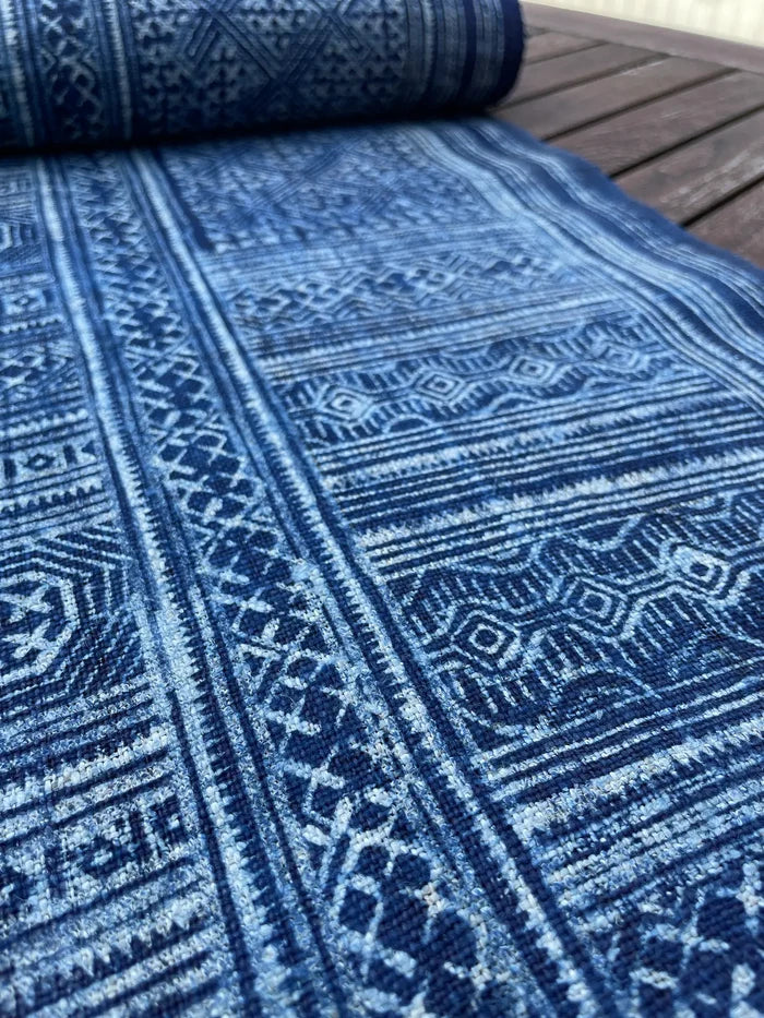Intricate labyrinth pattern in handwoven hemp, indigo batik