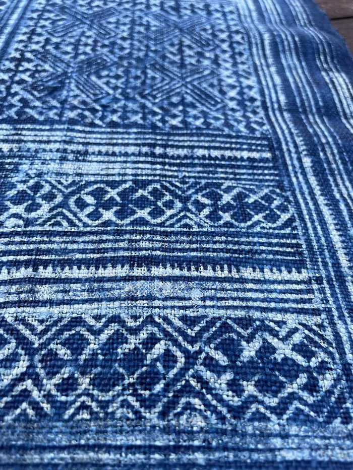 Intricate labyrinth pattern in handwoven hemp, indigo batik
