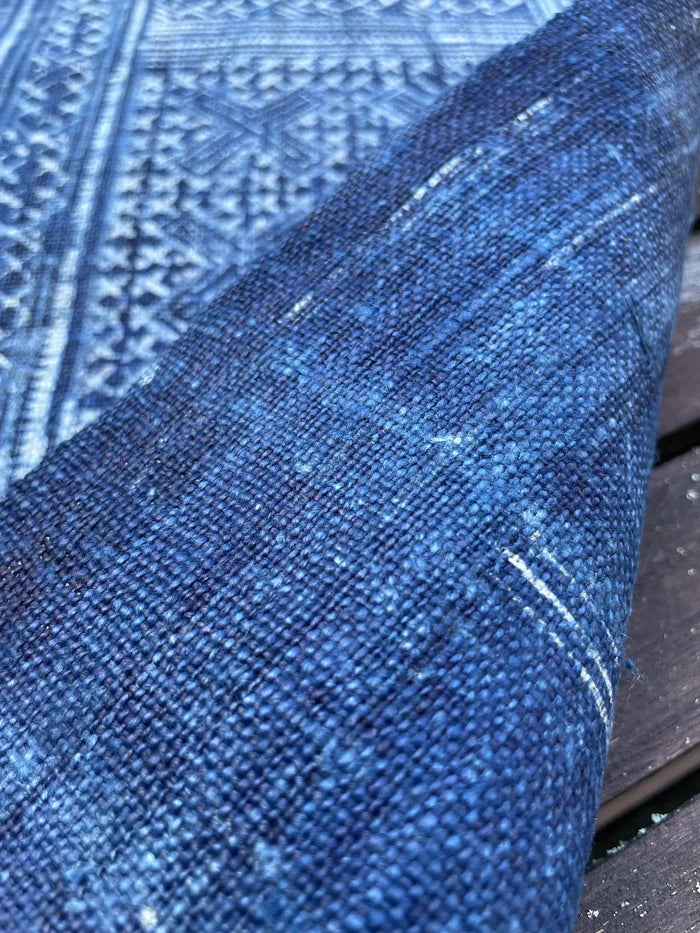 Intricate labyrinth pattern in handwoven hemp, indigo batik