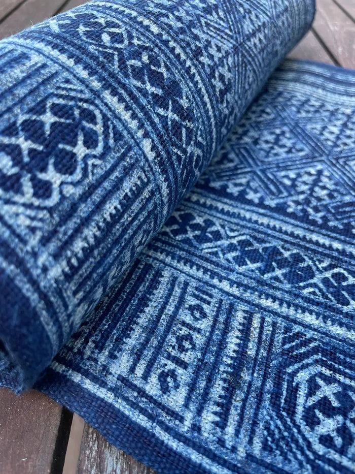 Intricate labyrinth pattern in handwoven hemp, indigo batik