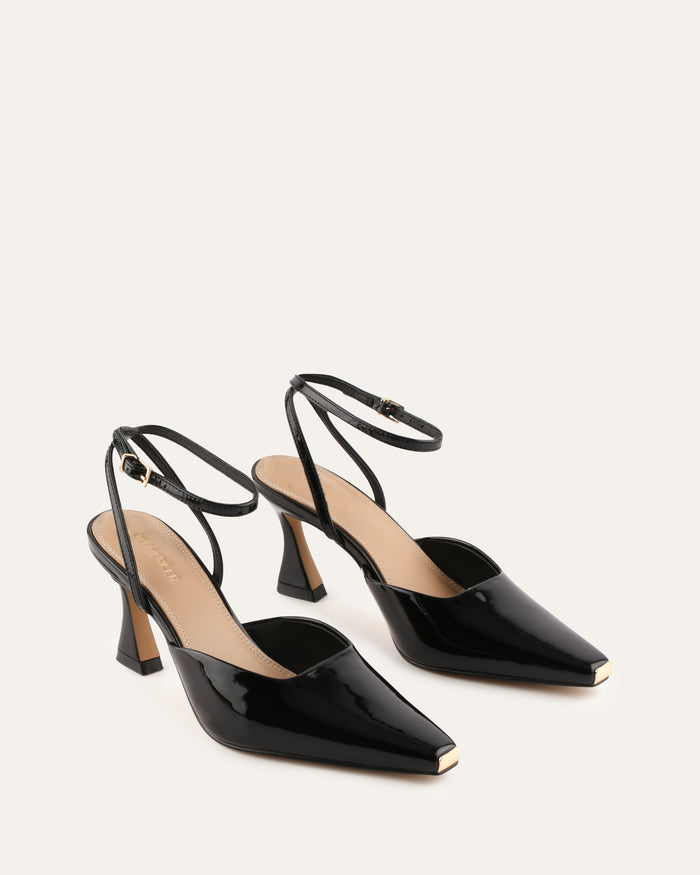 Black high-heeled shoes with slingback straps on a white background