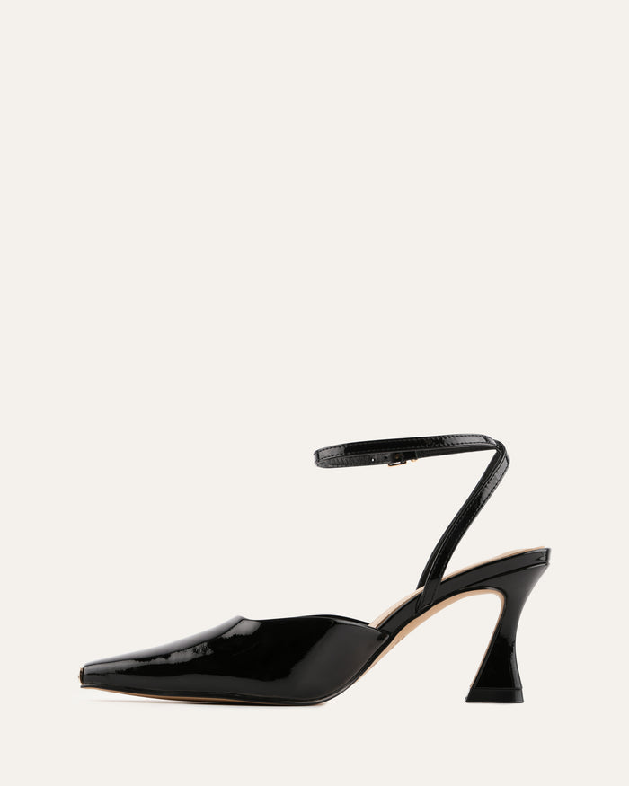 Black high-heeled shoes with a strap on a white background