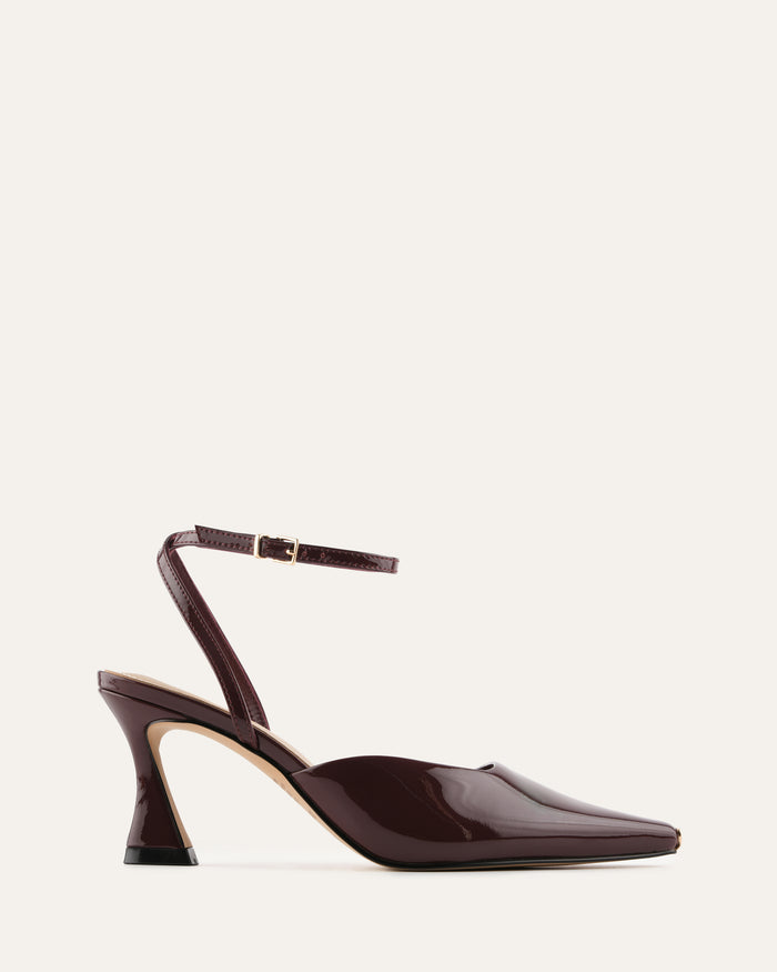 Burgundy high-heeled shoe on a light beige background