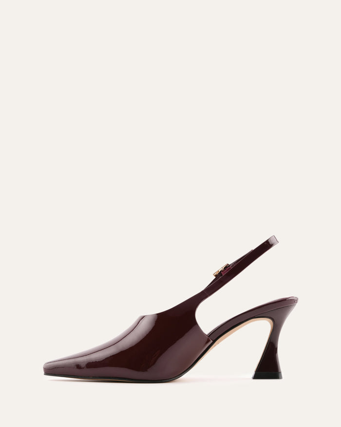 Patent leather slingback shoe on a white background