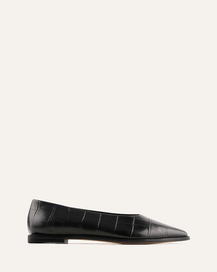 Black crocodile-patterned flat shoe on a white background