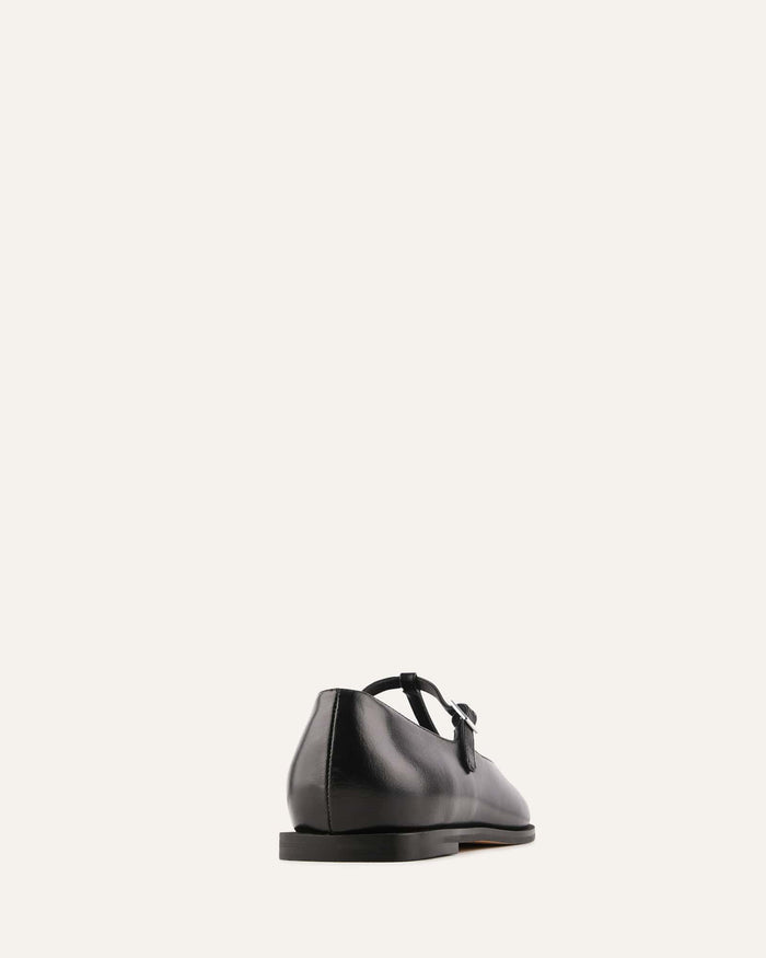 Black leather shoe on a white background