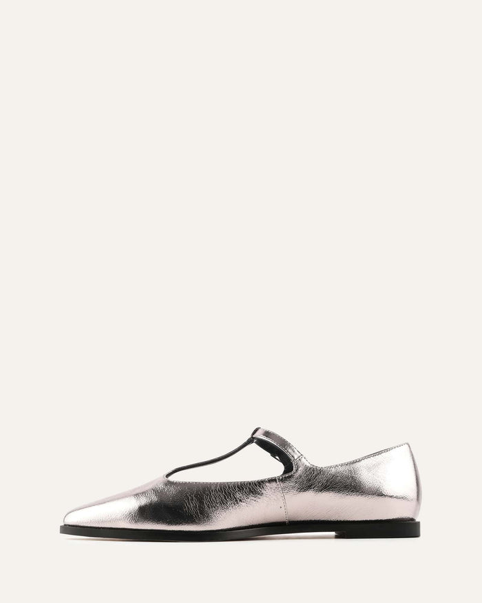 Silver slip-on shoe on a white background