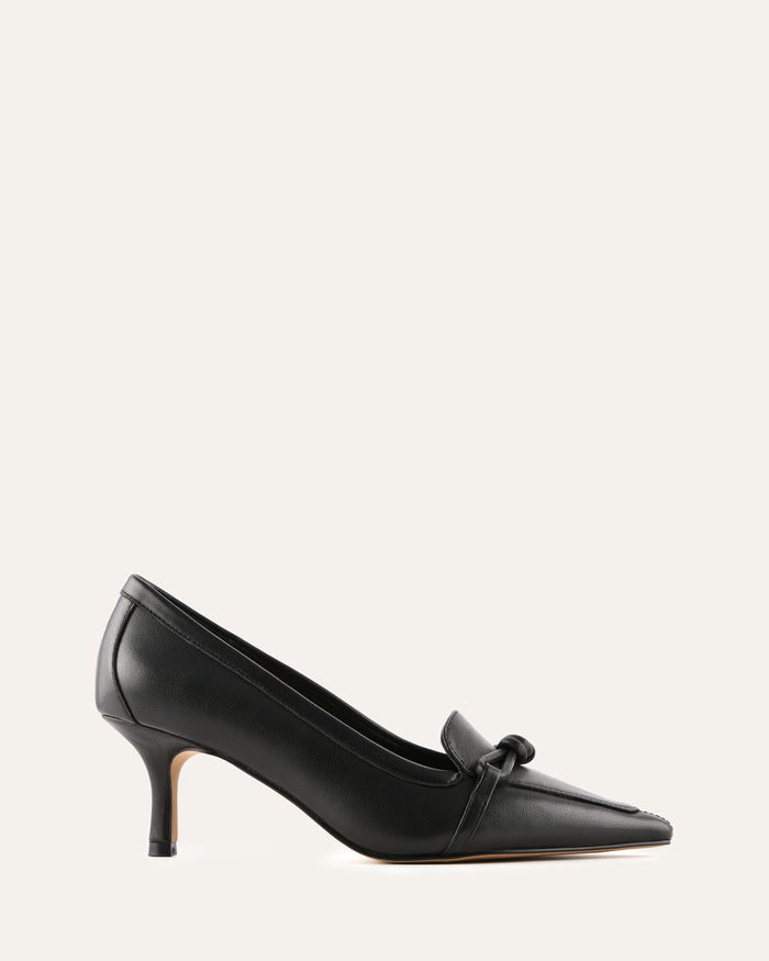 Black high-heeled shoes with a bow on a white background