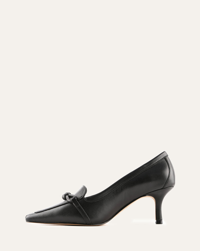 Black high-heeled shoe with a bow on a white background