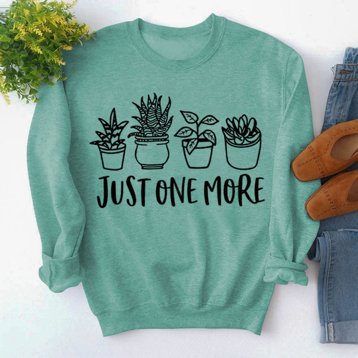 Light green sweater (black font) / S
