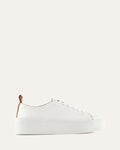 White sneaker on a light beige background
