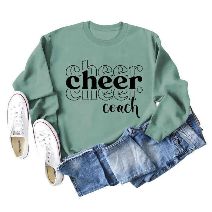 Light green sweater (black font) / S