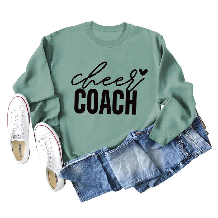Light green sweater (black font) / S
