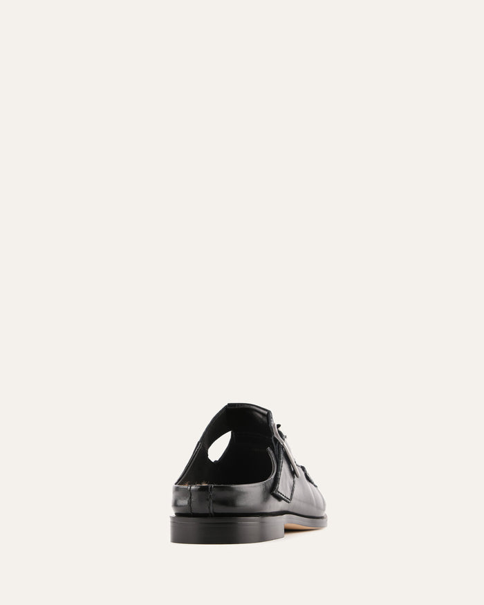 Black leather shoe on a white background