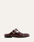 Brown loafer shoe with a buckle on a white background