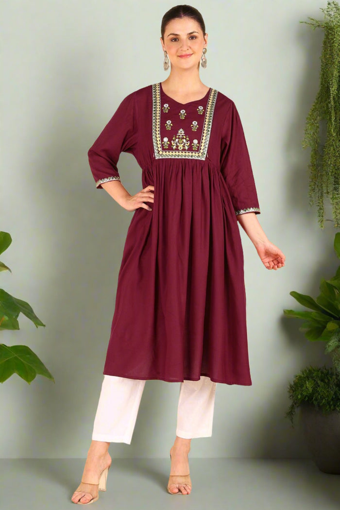 Full view of the Maroon Maternity Kurti Rayon Kurti on a model, highlighting its A-line fit and length.