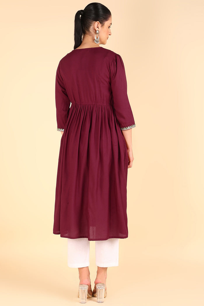 Side profile of the Maroon Maternity Kurti Kurti, demonstrating the comfortable A-line fit for pregnancy.