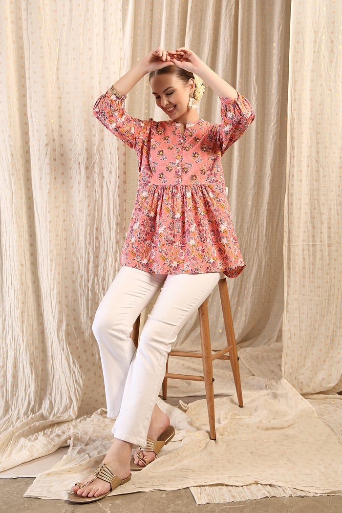 New mom wearing peach Maternity Tops; shows flattering post-delivery fit and Zipless.