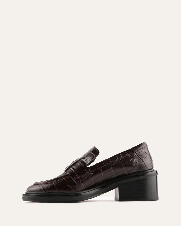 Beige slip-on shoe on a white background